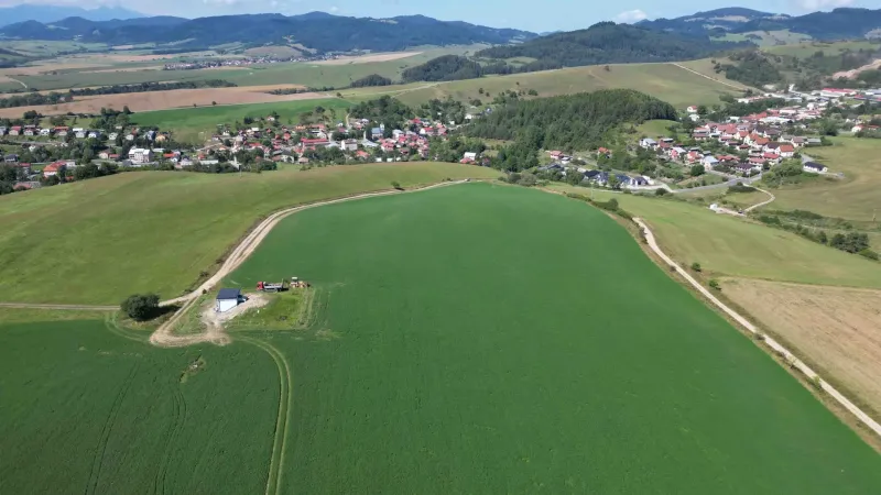 Aerial view of agricultural lands and a village around Stará Ľubovňa.
