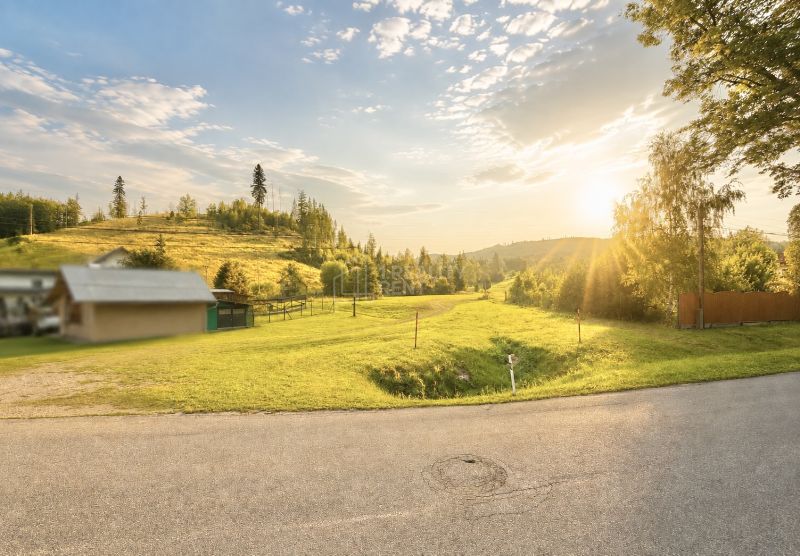 Sunny view of a meadow in Raková on Raková Street, ideal for residential plots.