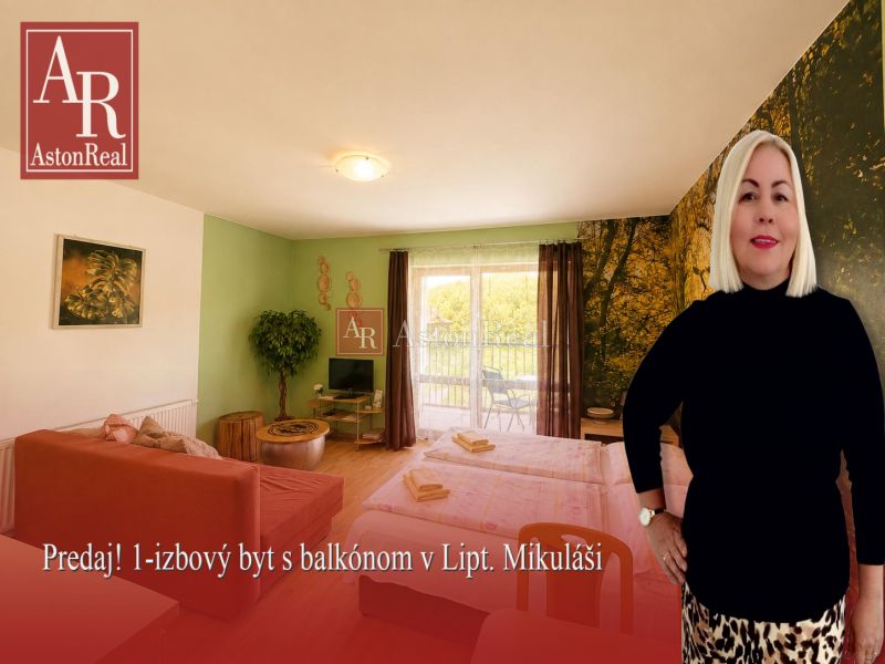 1-bedroom apartment with a wooden decor floor, natural motif on the wall, sofa, bed.