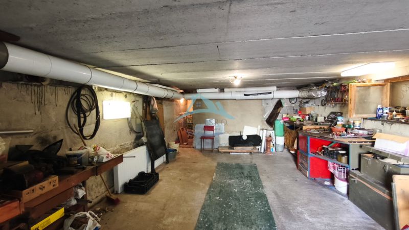 The basement of a family house in Nenince with storage space, tools, and organized supplies.