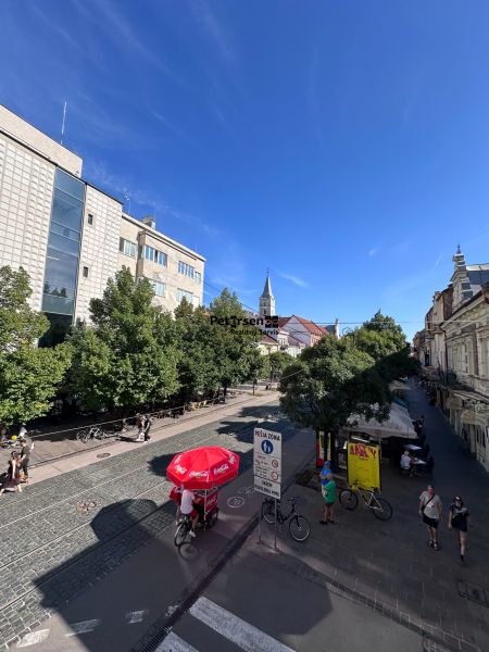 View of Hlavná Street in Košice, the Staré Mesto district, with cyclists.