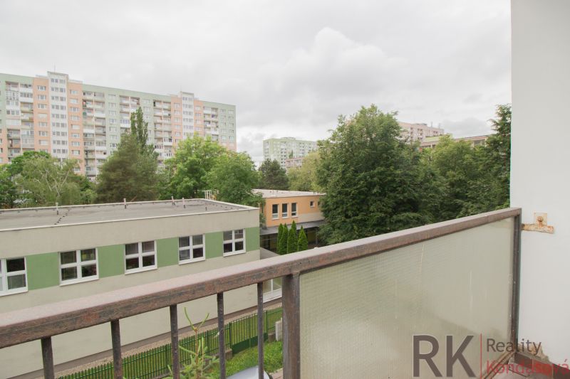 The view from the balcony on Jantárová Street in Košice, Juh district, surrounded by greenery.