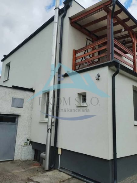 A family house with a balcony in the city with a verified member certificate of a real estate agency.