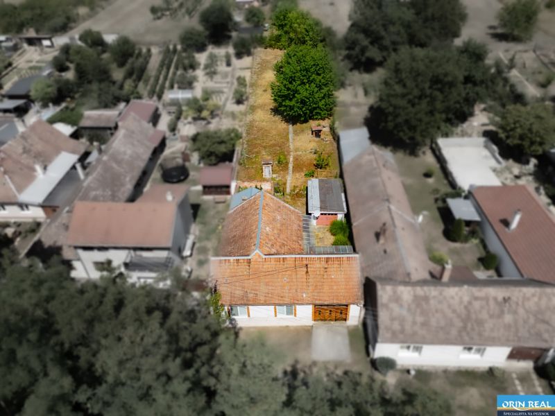 Aerial view of a family house in the village of Vištuk at Vištuk 158 with a large garden.