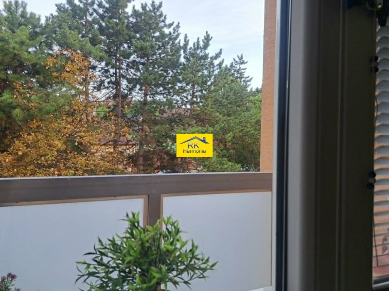 View from a 2-room apartment on Závalí in Hlohovec with a balcony and greenery.