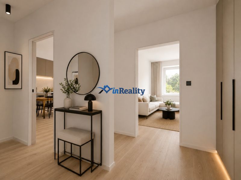 Interior of a 3-room apartment with a wooden decor floor and a mirror on the wall.
