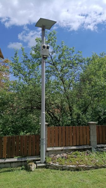 Solar lighting with a camera by the fence in the garden of a family house in Mikušovce.