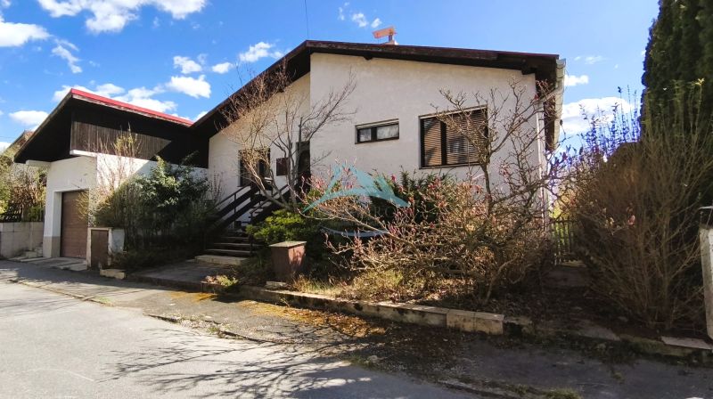 A family house on Ľ. Štúra in Veľký Krtíš with abundant greenery and a garage.