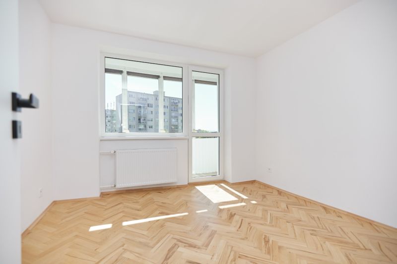 A bright room with a wooden decor floor in a 3-room apartment.