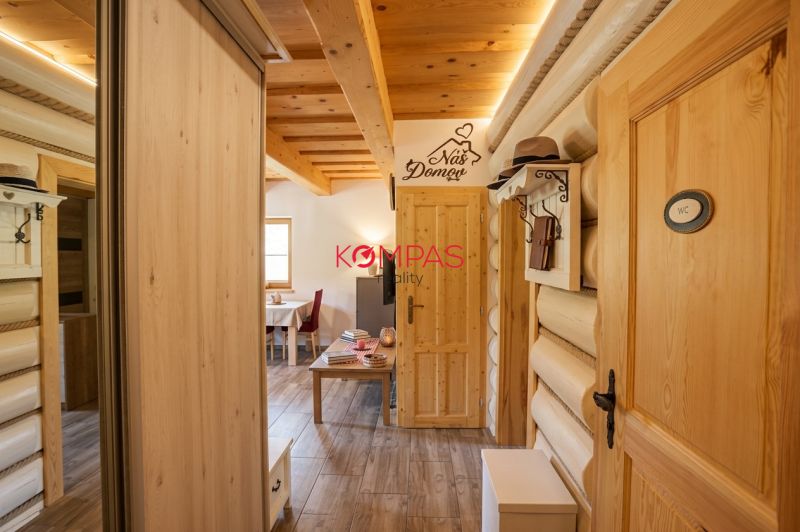 Interior of a family house with wooden details and a floor with a wood decor.
