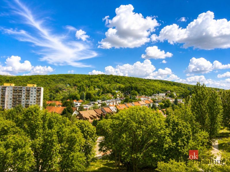 View of greenery and residential buildings in Bratislava-Lamač on Studenohorská Street.