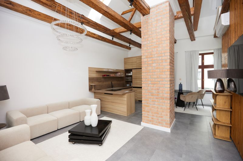 Living room in a 3-room apartment with a brick wall and a wooden decor floor.