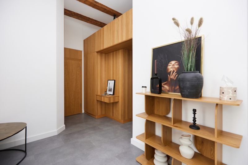 Interior of a 3-room apartment with wooden decor and elegant accessories.