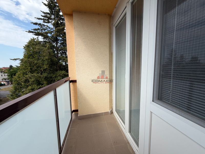 The balcony of a 3-room apartment on Vážska Street in Piešťany with a view of greenery.