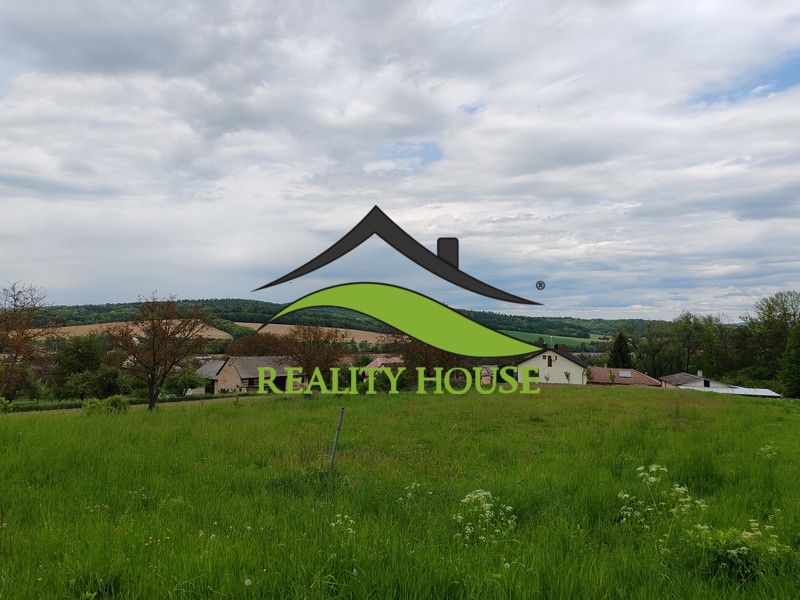 Land for residential use in Tovarnianska Polianka on Hlavná Street with a view of the countryside.