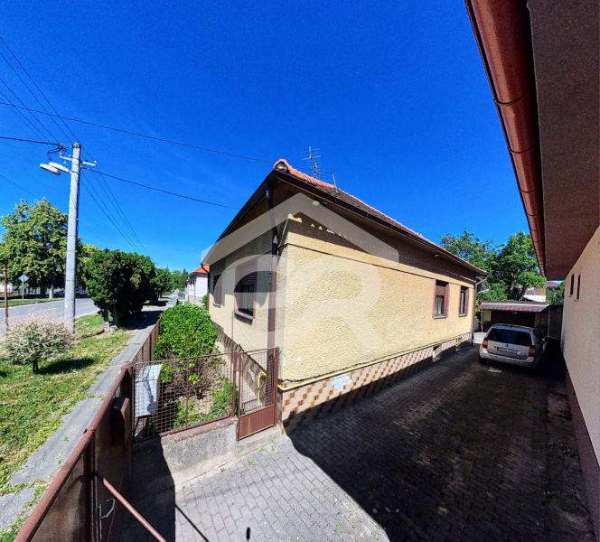A family house at Sladkovičova 135, Zlaté Moravce, with a car in the yard and a garden.