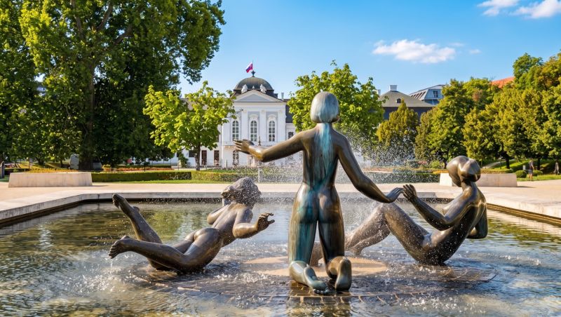 Fountain with bronze sculptures and the president in the gardens in Bratislava – Old Town on Banskobystrická.