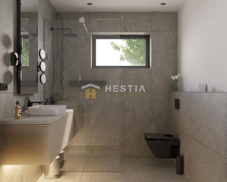 A bathroom in a family house with stylish tiles and modern accessories.