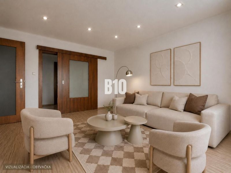 Living room in a 3-room apartment with a wooden decor floor and neutral furniture.