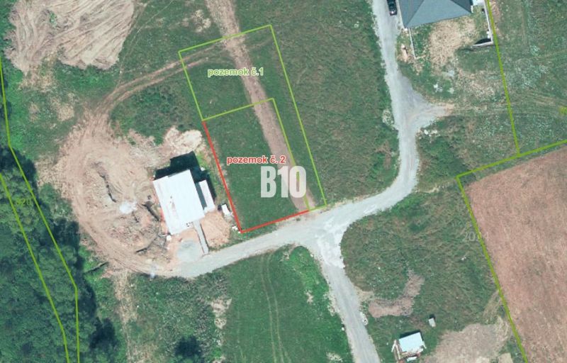 Aerial view of residential plots in the village of Bitarová, showing the surrounding area.