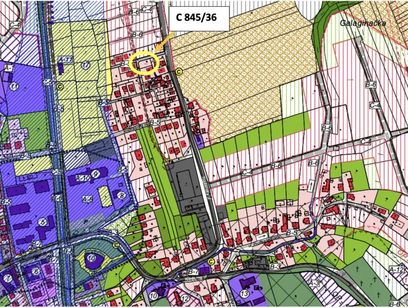 A map of the zoning plan in Raslavice with a designated residential plot.