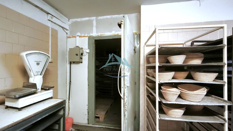 Internal production areas with scales and storage shelves.