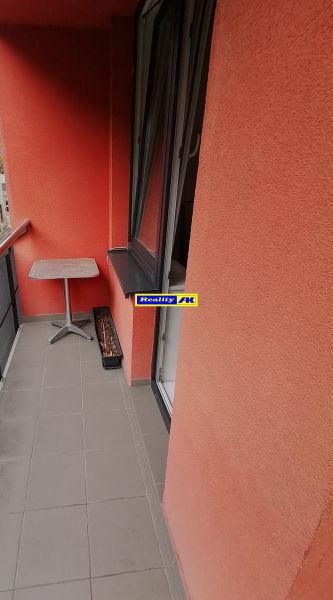 A balcony with red walls in a 2-room apartment on Nábrežná Street in Vrútky.