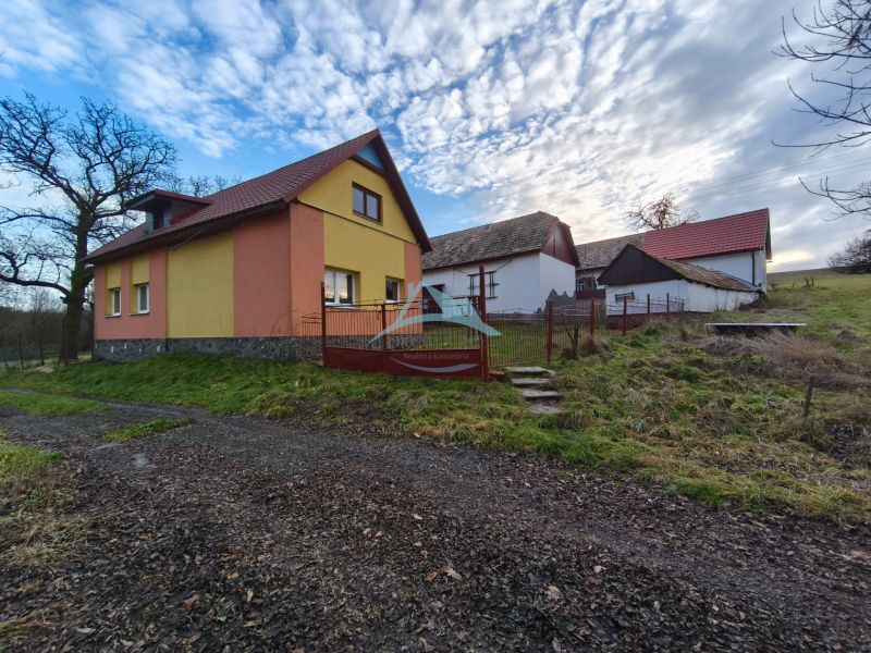 A family house on Prieloh Street in Dolná Strehová with adjacent buildings.