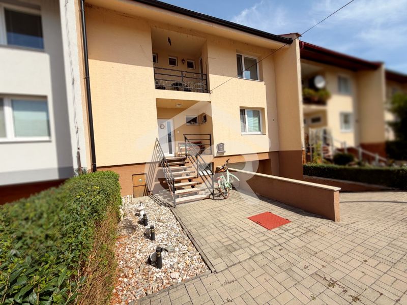 A family house on Vajka nad Žitavou Street in Lúčnica nad Žitavou with a front garden and a bicycle.