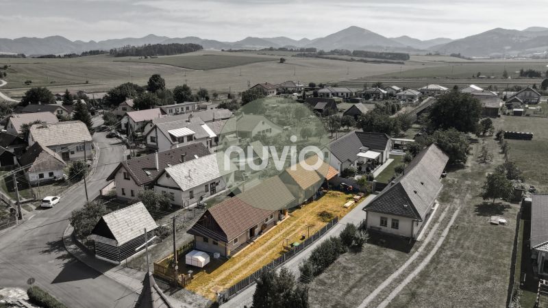 Aerial view of family houses in Žabokreky surrounded by fields and mountains.