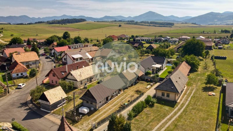 Žabokreky: Panorama of family houses with a rural character and hills in the background.