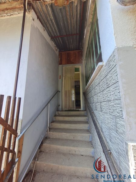 Stairs leading to the entrance of a family house in Dolné Otrokovce, covered by a roof.