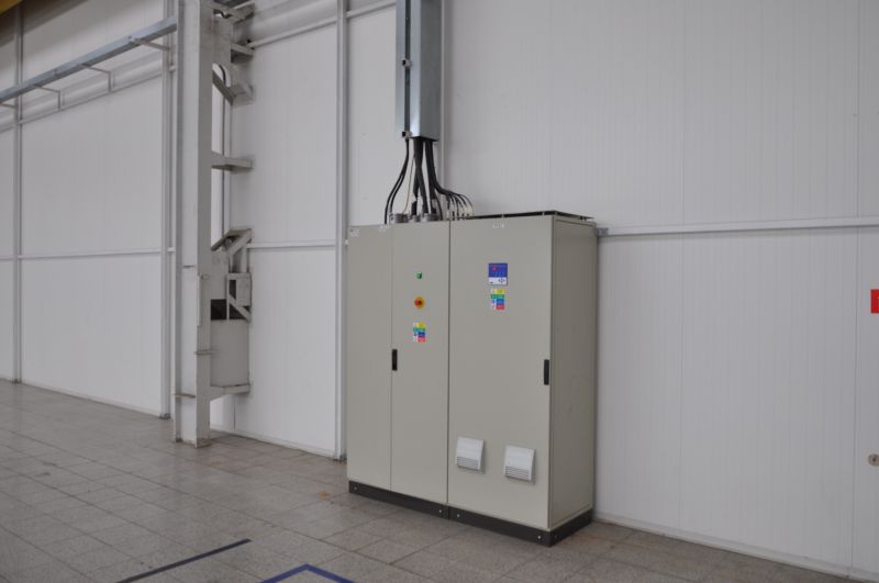 Distribution box in industrial production areas with tiled flooring.
