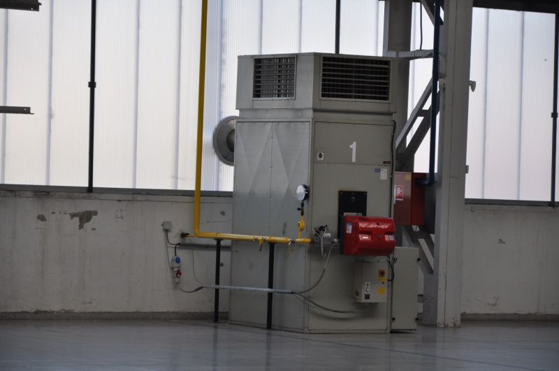 Industrial hall with technical equipment and metal structures in production areas.