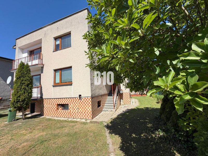 A family house in Kláštor pod Znievom with greenery and a balcony, set in a spacious garden.