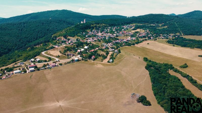 Aerial view of Podhradie with family houses and nature. Residential plots.