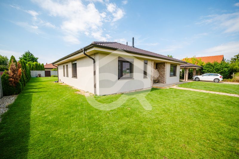 A family house on Družstevná Street in Vráble with a well-maintained garden and parking.