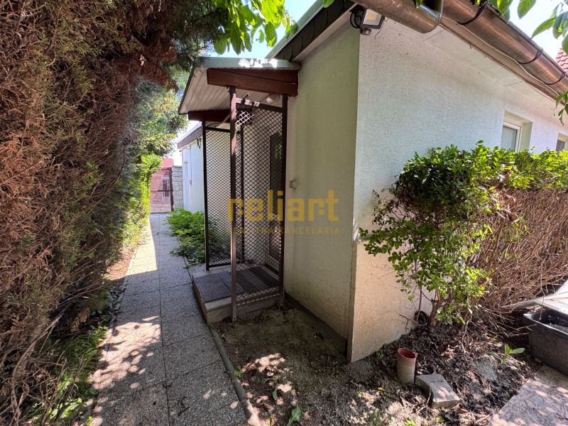 Family house on Senná Street in Bratislava - Ružinov, side garden with a walkway.