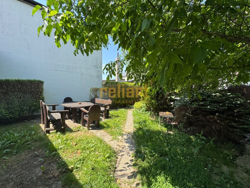 The garden of a family house on Senná Street in Bratislava - Ružinov, with seating in pleasant shade.