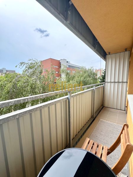 The balcony of a 1-room apartment on Sekurisova Street in Bratislava - Dúbravka with a view of greenery.