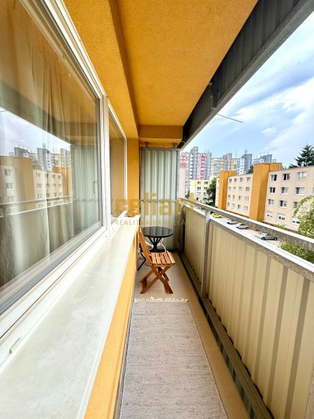 A balcony with seating on Sekurisova Street in a 1-room apartment in Bratislava - Dúbravka.