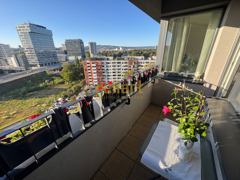 A balcony with plants and a view of Bosákova Street, Bratislava - Petržalka.