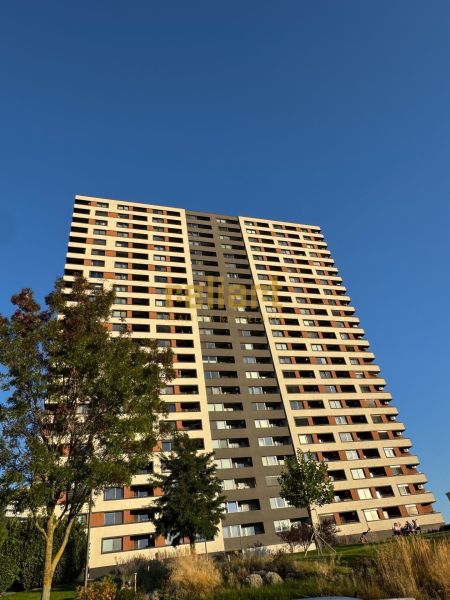 A high-rise building on Bosákova Street in Bratislava - Petržalka, surrounded by greenery.