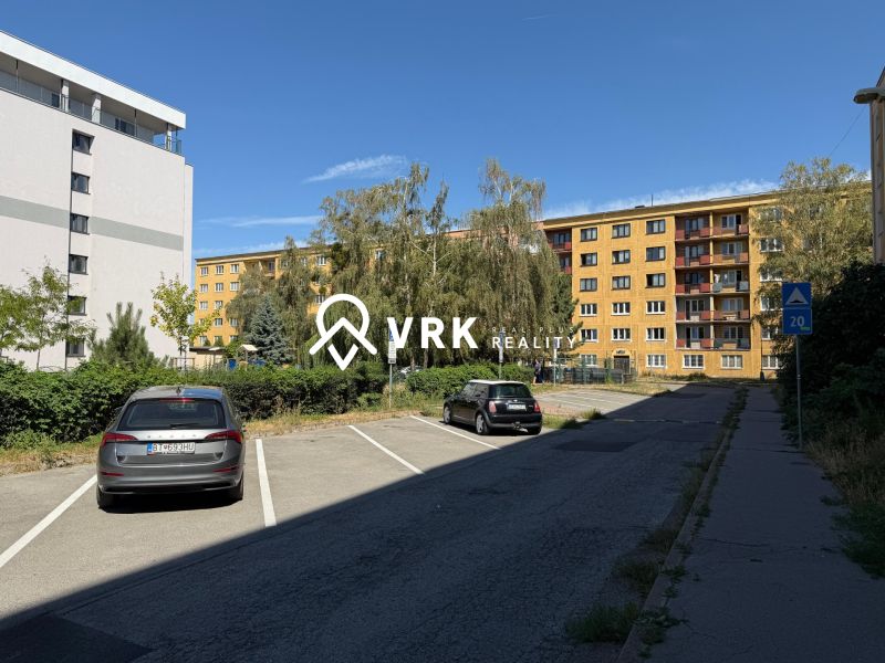 Apartment buildings with greenery and parking on Stromová Street in Košice, Old Town.