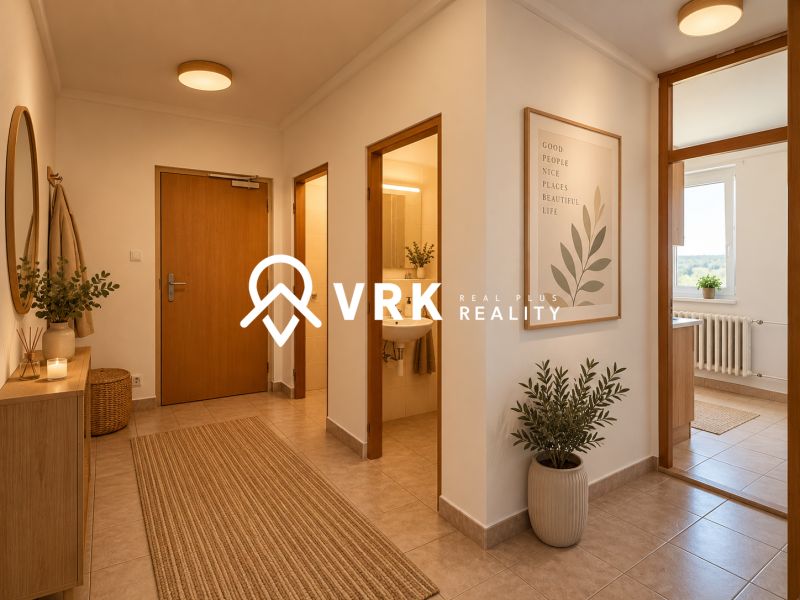 A hallway in a 2-room apartment with wooden furniture and decorative plants.