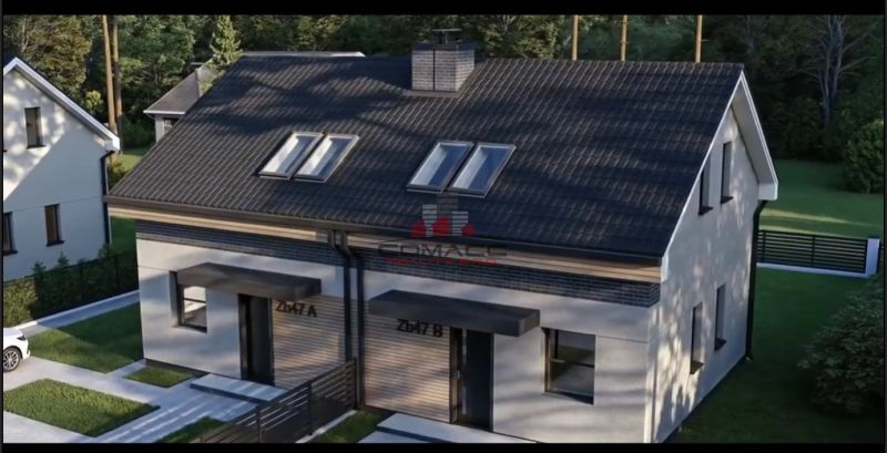 A semi-detached house on Sasinkovo Street in Sasinkovo with a sloped roof and a lawn.