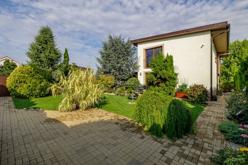 A family house on Majerská Street in Nová Dedinka with a landscaped garden and paving.