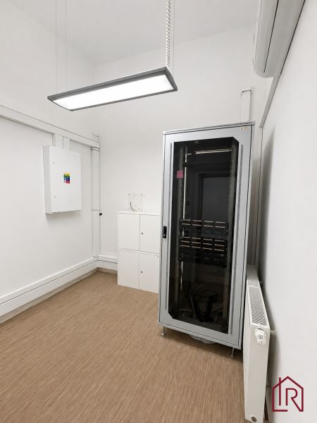 Distribution cabinet and cabinets in an office with a wooden decor floor.