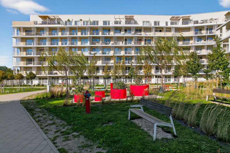 Residential complex with a children's playground and benches in Bratislava - New Ružinov on Bajkalská.