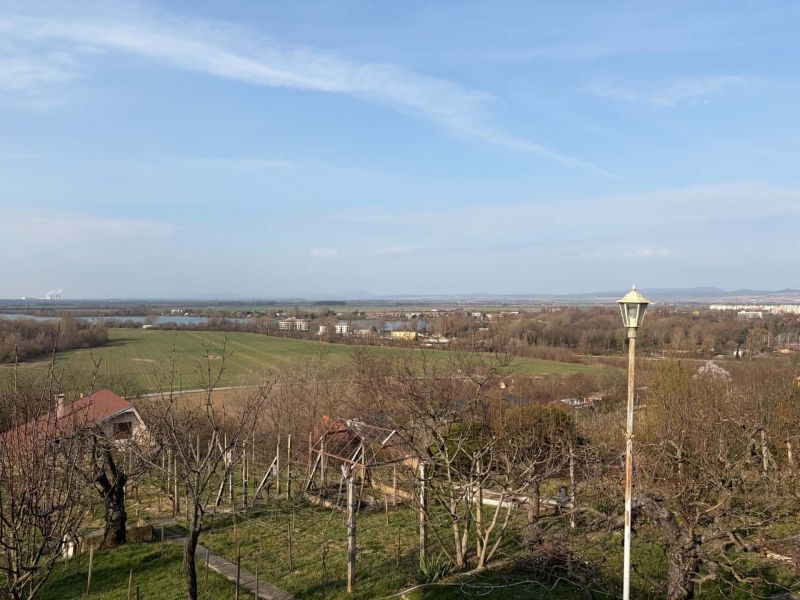 The view from the cottage near Banka offering greenery and distant fields.